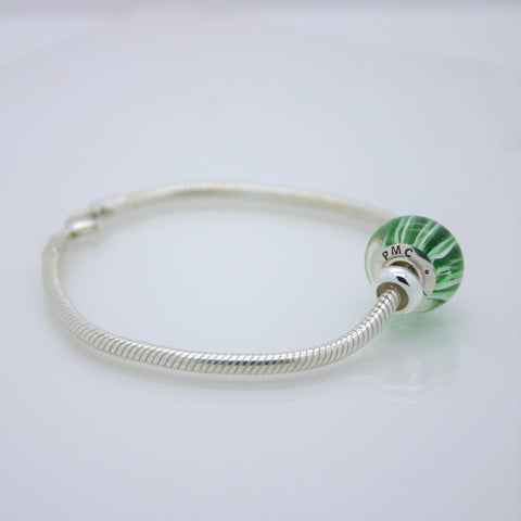 The PMC 2017 bead on our sterling silver snake chain bracelet
